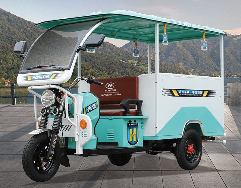 semi-closed electric tricycle in cyan and white3